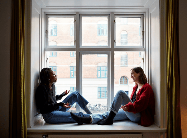 People sitting by a window