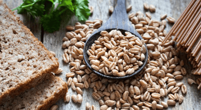 A selection of wholegrain foods including wholemeal bread, spelt and wholemeal pasta